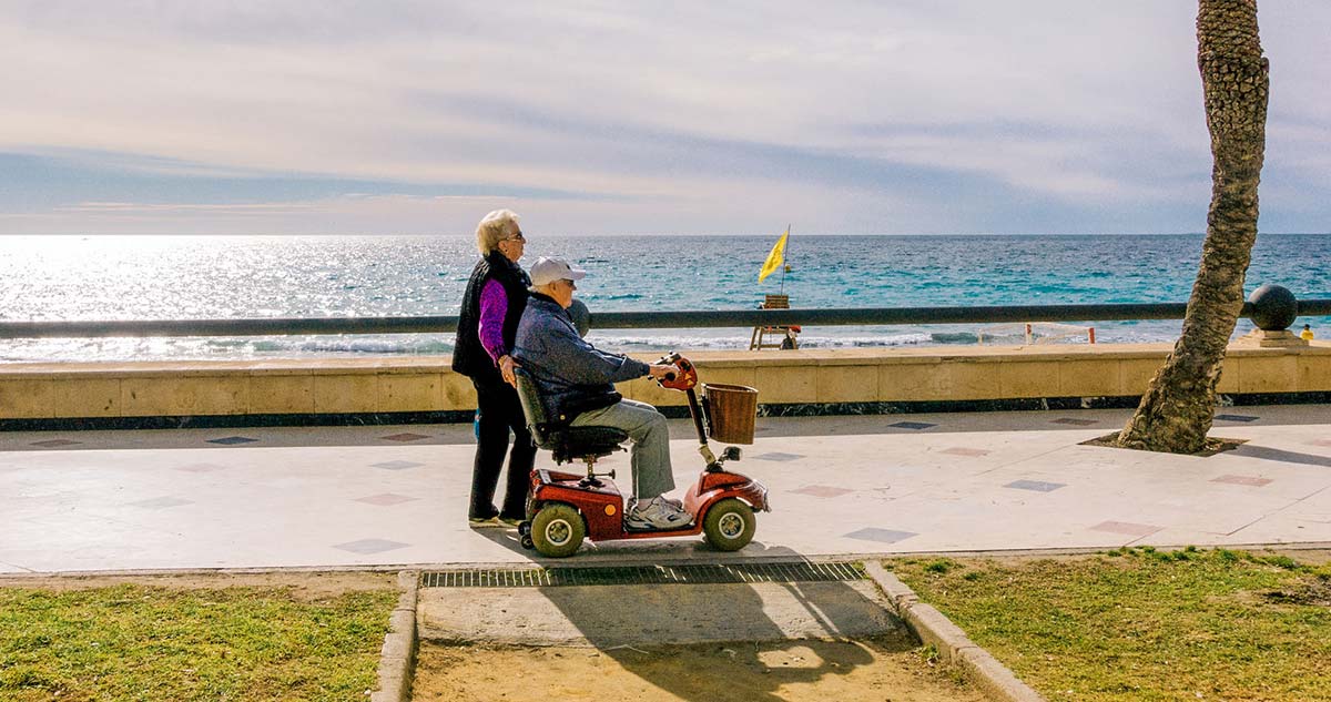 Benidorm, Spain – January 14, 2018: People walking enjoying holiday near the sea, Benidorm, Spain.